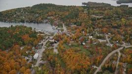 5.5K aerial stock footage flying over small rural town, pan to Sunapee Harbor, autumn, Sunapee, New Hampshire Aerial Stock Footage | AX151_079E
