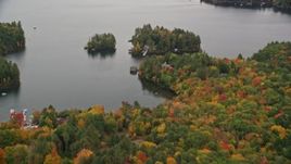 5.5K aerial stock footage approaching waterfront mansion, small island, Lake Sunapee, autumn, Sunapee, New Hampshire Aerial Stock Footage | AX151_082