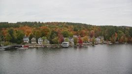 5.5K aerial stock footage orbiting colorful forest, waterfront homes, Lake Sunapee, autumn, Newbury, New Hampshire Aerial Stock Footage | AX151_088E