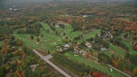 5.5K aerial stock footage flying by Lake Sunapee Golf Course, autumn, New London, New Hampshire Aerial Stock Footage | AX151_106E