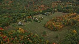 5.5K aerial stock footage approaching rural homes, grassy clearing, tilt down, autumn, Penacook, New Hampshire Aerial Stock Footage | AX151_140