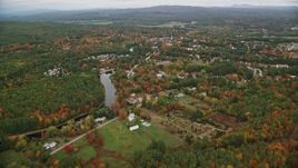 5.5K aerial stock footage approaching small rural town, river, trees, autumn, Penacook, New Hampshire Aerial Stock Footage | AX151_142E
