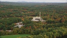 5.5K aerial stock footage flying by factory, smoke stack, colorful trees in autumn, Penacook, New Hampshire Aerial Stock Footage | AX151_153