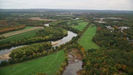 5.5K aerial stock footage approaching the Merrimack River, trees in autumn, Concord, New Hampshire Aerial Stock Footage | AX151_155E