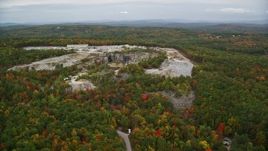 5.5K aerial stock footage orbiting a quarry, colorful foliage, autumn, overcast, Concord, New Hampshire Aerial Stock Footage | AX151_161