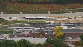 5.5K aerial stock footage orbiting the New Hampshire State Prison, light traffic, autumn, Concord, New Hampshire Aerial Stock Footage | AX151_177