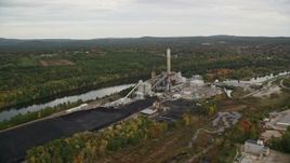 5.5K aerial stock footage flying over Merrimack River, approaching a power plant, autumn, Bow, New Hampshire Aerial Stock Footage | AX152_004E