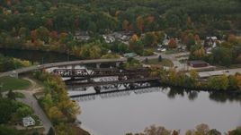 5.5K aerial stock footage orbiting small bridges, Merrimack River, autumn, Hooksett, New Hampshire Aerial Stock Footage | AX152_014