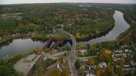 5.5K aerial stock footage orbiting small town, homes, small bridges, Merrimack River, autumn, Hooksett, New Hampshire Aerial Stock Footage | AX152_015E