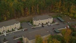 5.5K aerial stock footage flying by apartment buildings, colorful trees in autumn, Hooksett, New Hampshire Aerial Stock Footage | AX152_021