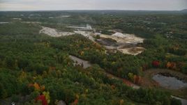 5.5K aerial stock footage flying over colorful trees, approaching small quarry, autumn, Hooksett, New Hampshire Aerial Stock Footage | AX152_023