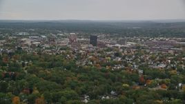 5.5K aerial stock footage flying by downtown office towers, colorful foliage, autumn, overcast, Manchester, New Hampshire Aerial Stock Footage | AX152_040E