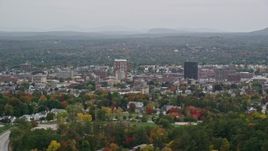 5.5K aerial stock footage flying by downtown office towers, overcast skies, autumn, Manchester, New Hampshire Aerial Stock Footage | AX152_042E