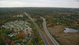 5.5K aerial stock footage flying over Interstate 93, brightly colored foliage, autumn, Manchester, New Hampshire Aerial Stock Footage | AX152_048