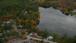 5.5K aerial stock footage flying by Crystal Lake, waterfront homes, autumn, Manchester, New Hampshire Aerial Stock Footage | AX152_049