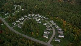 5.5K aerial stock footage flying by tract homes, colorful trees in autumn, tilt down, Manchester, New Hampshire Aerial Stock Footage | AX152_050