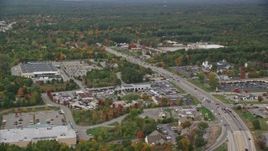 5.5K aerial stock footage flying by car dealership, strip mall, Nashua Road, autumn, Londonderry, New Hampshire Aerial Stock Footage | AX152_054E