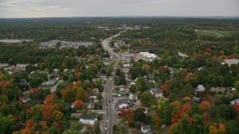 5.5K aerial stock footage flying by neighborhoods, Broadway, car auction, autumn, Derry, New Hampshire Aerial Stock Footage | AX152_059E