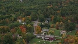 5.5K aerial stock footage flying by rural homes, colorful foliage in autumn, Windham, New Hampshire Aerial Stock Footage | AX152_066