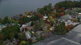 5.5K aerial stock footage orbiting Canobie Lake Park, colorful trees in autumn, Salem, New Hampshire Aerial Stock Footage | AX152_072