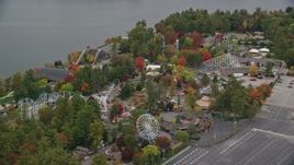5.5K aerial stock footage orbiting Canobie Lake Park, colorful trees in autumn, Salem, New Hampshire Aerial Stock Footage | AX152_072E