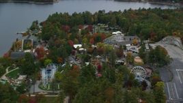 5.5K aeria video orbiting colorful foliage, Canobie Lake Park, autumn, Salem, New Hampshire Aerial Stock Footage | AX152_073