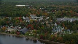 5.5K aerial stock footage orbiting waterfront Canoe Lake Park, autumn, Canobie Lake Park, Salem, New Hampshire Aerial Stock Footage | AX152_074