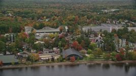 5.5K aerial stock footage circling the waterfront Canoe Lake Park, autumn, Canobie Lake Park, Salem, New Hampshire Aerial Stock Footage | AX152_074E