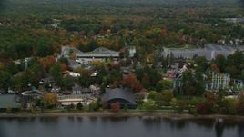5.5K aerial stock footage orbiting trees, waterfront Canobie Lake Park, autumn, Salem, New Hampshire Aerial Stock Footage | AX152_075
