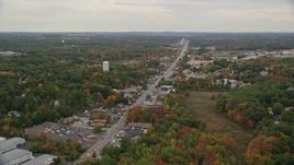 5.5K aerial stock footage flying by shops, Broadway, colorful trees, autumn, overcast, Salem, New Hampshire Aerial Stock Footage | AX152_078