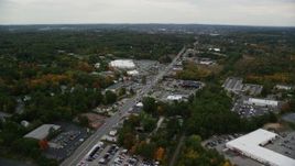 5.5K aerial stock footage flying over Broadway, approaching stores and tilt down, Salem, New Hampshire Aerial Stock Footage | AX152_083