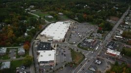 5.5K aerial stock footage flying by Lowes, businesses, autumn, Salem, New Hampshire Aerial Stock Footage | AX152_084