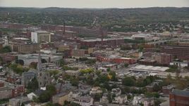 5.5K aerial stock footage flying by church, factories, smoke stacks, autumn, overcast, Lawrence, Massachusetts Aerial Stock Footage | AX152_087