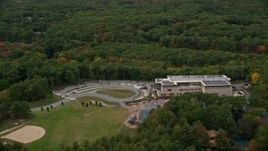 5.5K aerial stock footage approaching Joseph Estabrook Elementary School, autumn, Lexington, Massachusetts Aerial Stock Footage | AX152_168
