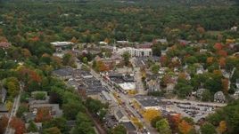 5.5K aerial stock footage flying by church and shops along busy streets in autumn, Wellesley, Massachusetts Aerial Stock Footage | AX152_186