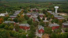 5.5K aerial stock footage flying over autumn trees toward Medfield State Hospital, Medfield, Massachusetts Aerial Stock Footage | AX152_202E