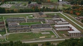 5.5K aerial stock footage approaching Massachusetts Correctional Institution at Norfolk, surrounded by fall foliage, Massachusetts Aerial Stock Footage | AX152_212