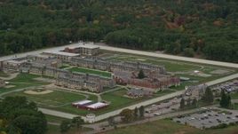 5.5K aerial stock footage of a high approach toward Massachusetts Correctional Institution at Norfolk, and fall foliage, Massachusetts Aerial Stock Footage | AX152_226E