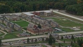 5.5K aerial stock footage of Massachusetts Correctional Institution at Norfolk and fall foliage,  Massachusetts Aerial Stock Footage | AX152_228