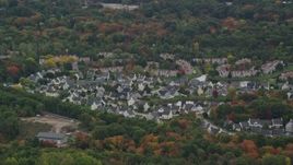 5.5K aerial stock footage of suburban homes among fall foliage, Walpole, Massachusetts Aerial Stock Footage | AX152_229