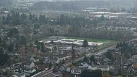 5.5K aerial stock footage flying by an elementary school in autumn, Beaverton, Oregon Aerial Stock Footage | AX153_003