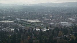 5.5K aerial stock footage flying by shopping centers on a cloudy day, autumn, Beaverton, Oregon Aerial Stock Footage | AX153_005