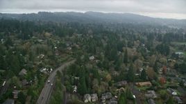 5.5K aerial stock footage flying over trees and residential area on a cloudy day, autumn, Portland, Oregon Aerial Stock Footage | AX153_006E
