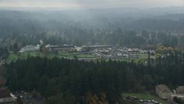 5.5K aerial stock footage flying by Alpenrose Dairy Company and baseball fields with godrays, Dairyville, Portland, OR Aerial Stock Footage | AX153_008E