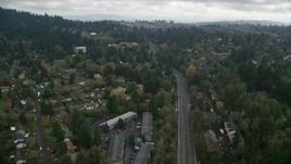 5.5K aerial stock footage flying over residential area toward a hilltop preschool on a cloudy day, autumn, Portland, Oregon Aerial Stock Footage | AX153_010