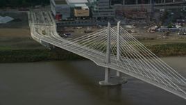 5.5K aerial stock footage flying away from Tilikum Crossing, cable stayed bridge, Downtown Portland, Oregon Aerial Stock Footage | AX153_035