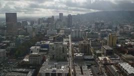 5.5K aerial stock footage flying by skyscrapers and high-rises, partly cloudy, Downtown Portland, Oregon Aerial Stock Footage | AX153_045E