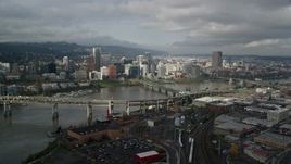 5.5K aerial stock footage approach and fly over Marquam and Hawthorne Bridge toward skyline, Downtown Portland, Oregon Aerial Stock Footage | AX153_053E