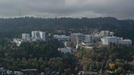 5.5K aerial stock footage of a reverse view of the Oregon Health and Science University in Portland, Oregon Aerial Stock Footage | AX153_082
