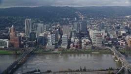 5.5K aerial stock footage of skyscrapers and Morrison Bridge seen from across the Willamette River, Downtown Portland, Oregon Aerial Stock Footage | AX153_121
